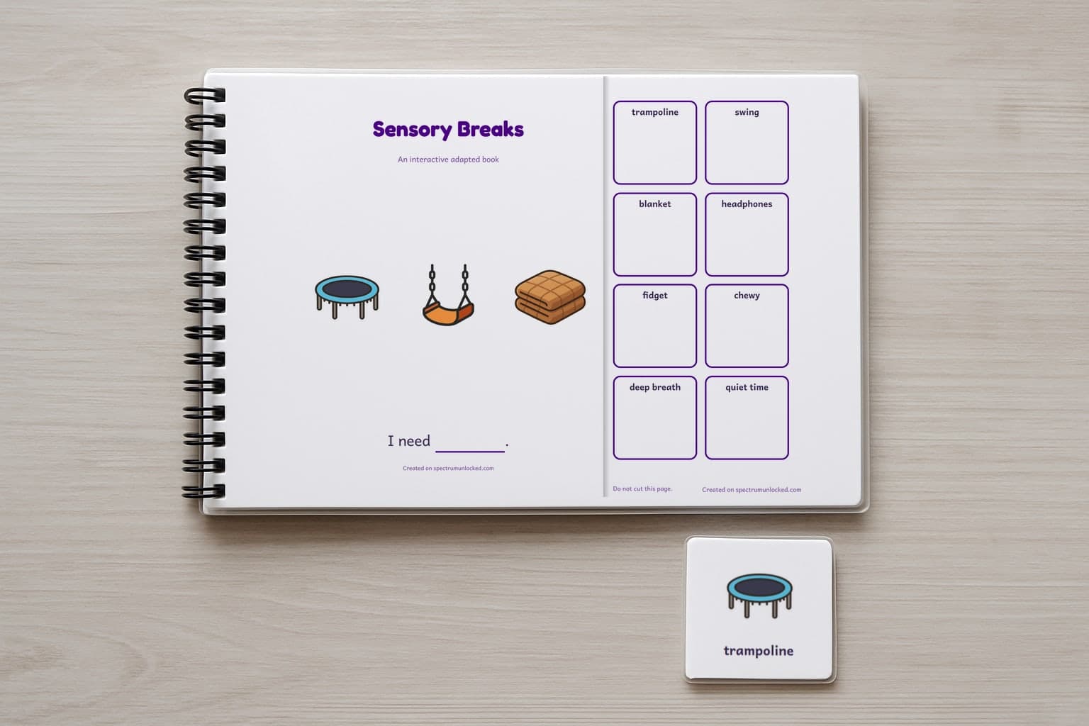The Sensory Breaks adapted book closed on a table, its cover facing up, one picture card beside it