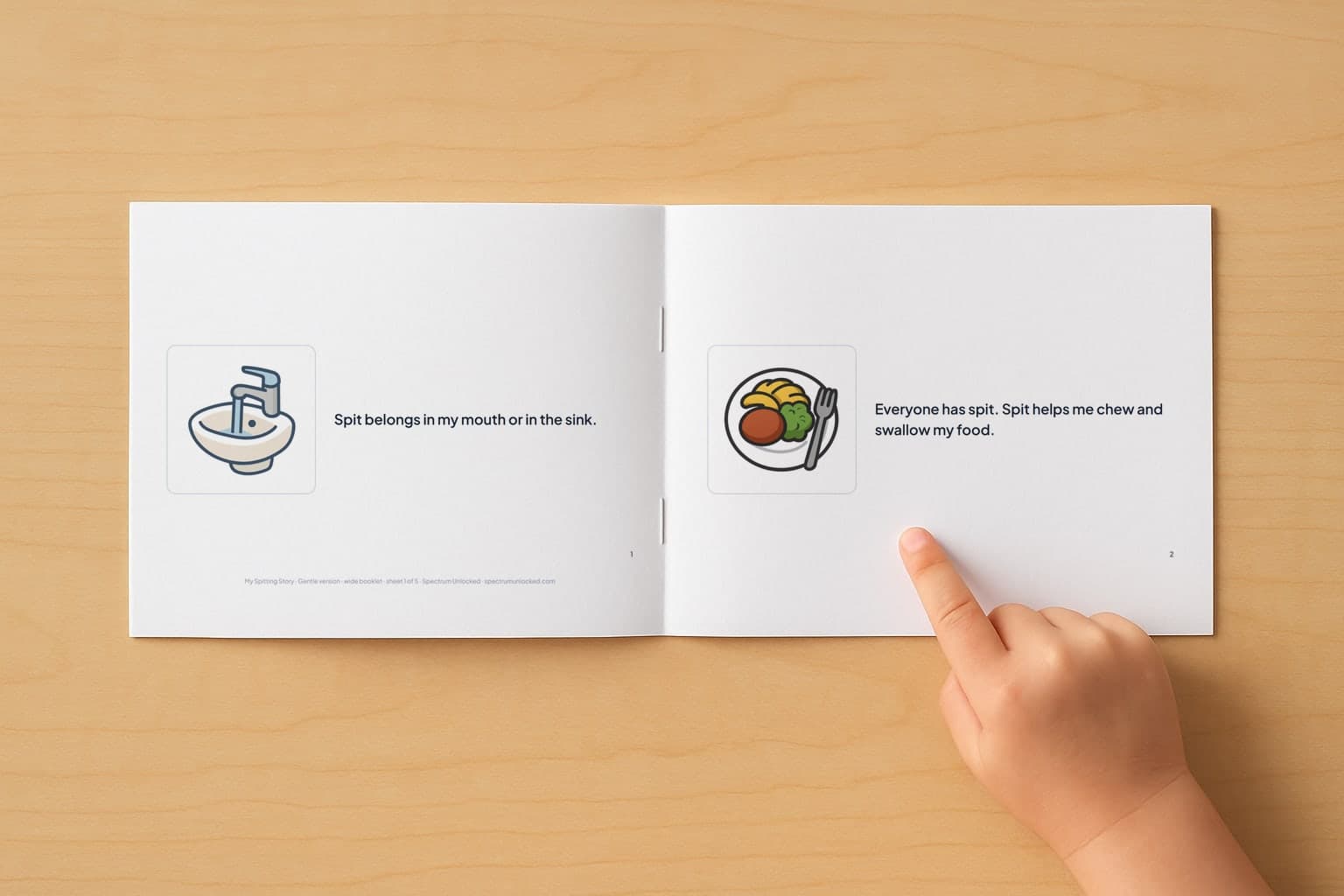 The Spitting social story booklet open to its first two pages, a child's finger pointing at the picture