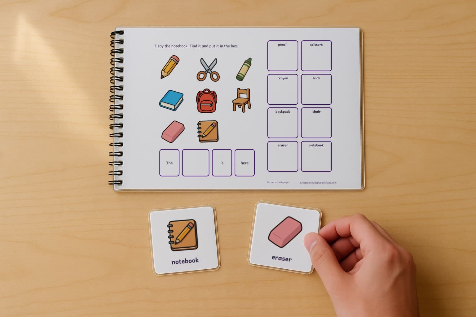 The last page of the I Spy Classroom Objects adapted book with its choice column, two picture cards resting beside it