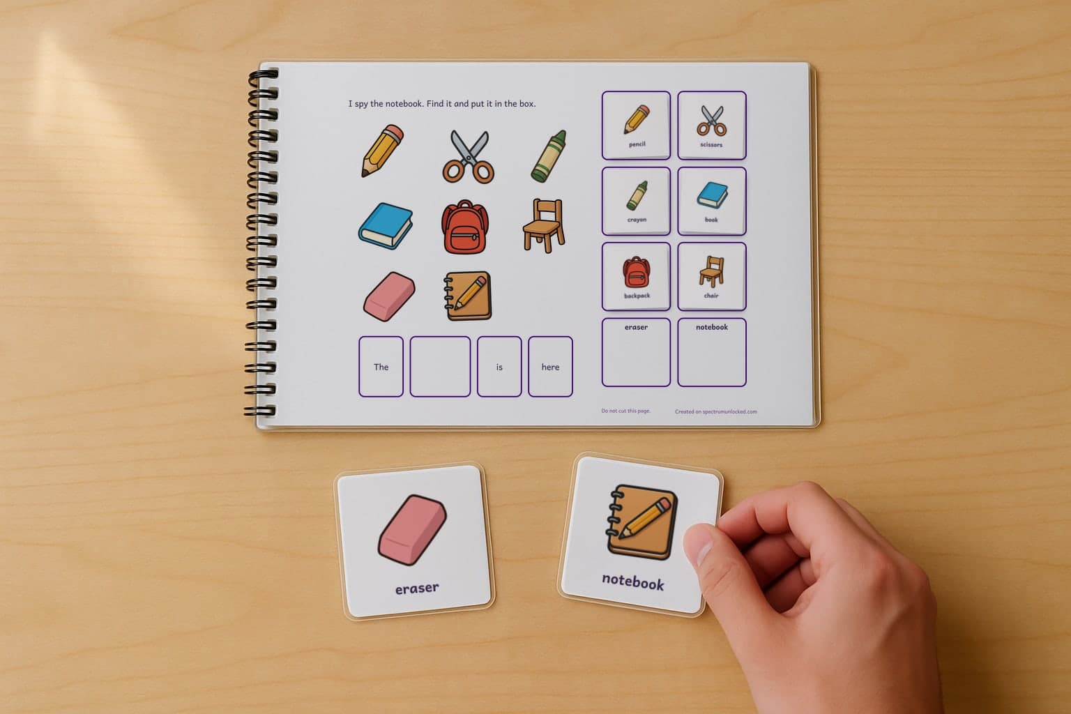 The I Spy Classroom Objects adapted book with its picture cards stored on the choice column, the last two loose on the table