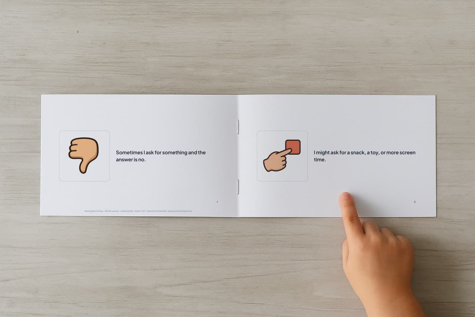 The Accepting No social story booklet open to its first two pages, a child's finger pointing at the picture