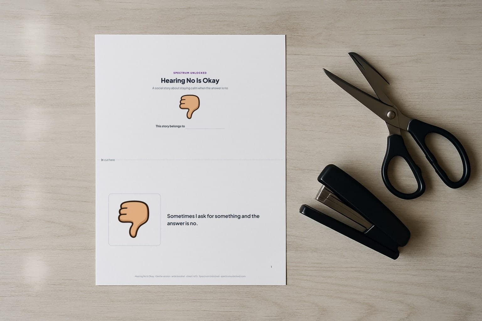 The Accepting No social story printed two pages to a Letter sheet, scissors and a stapler beside it before the cut