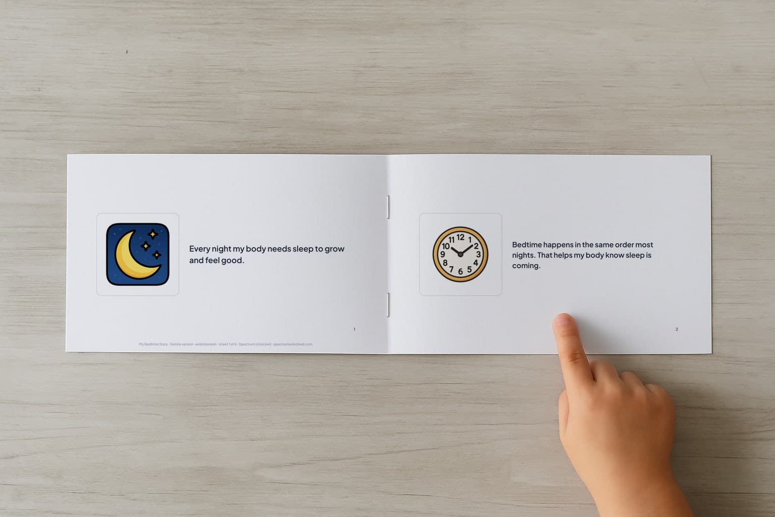 The Bedtime social story booklet open to its first two pages, a child's finger pointing at the picture