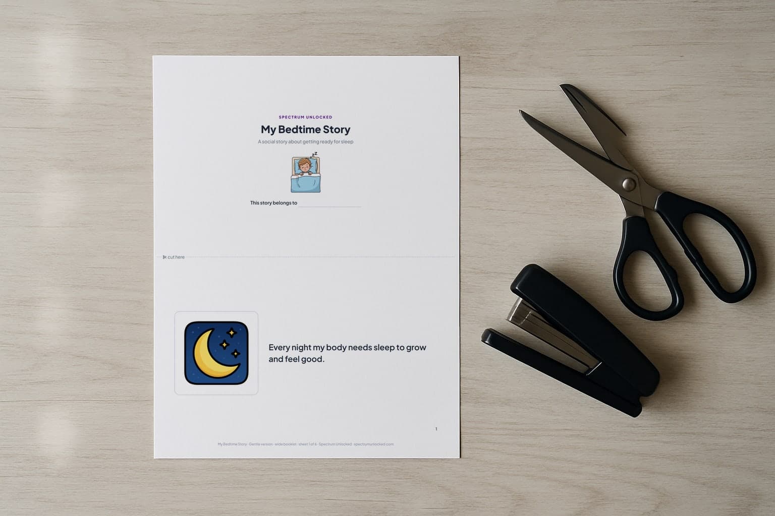 The Bedtime social story printed two pages to a Letter sheet, scissors and a stapler beside it before the cut