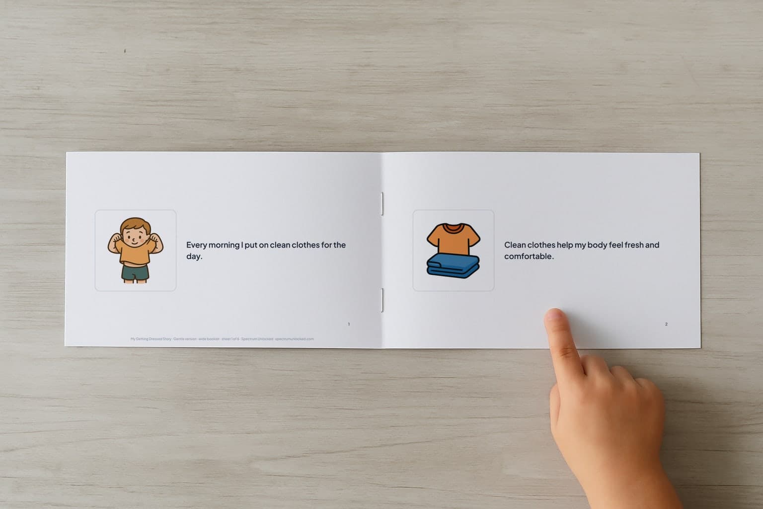 The Getting Dressed social story booklet open to its first two pages, a child's finger pointing at the picture