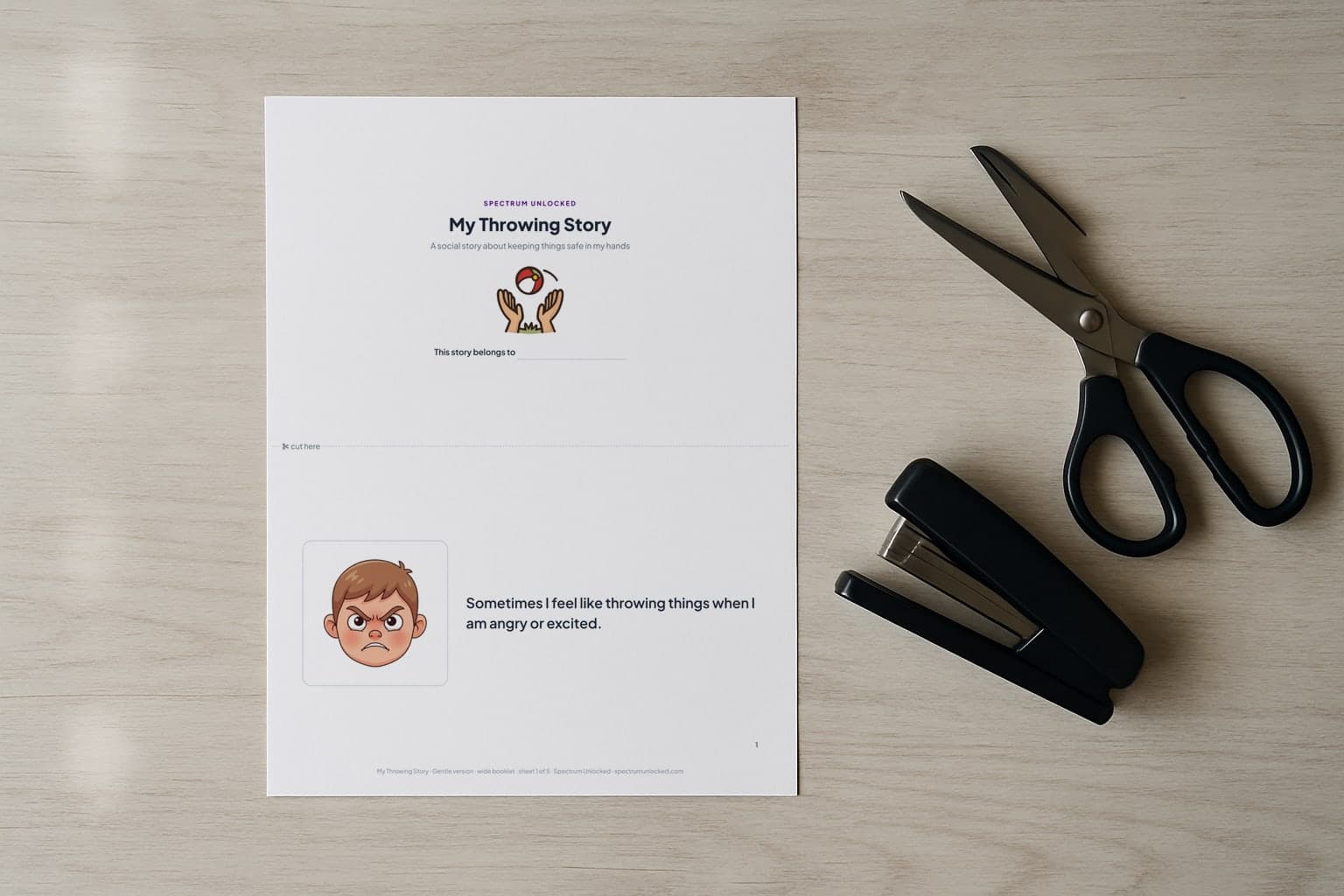 The Throwing Things social story printed two pages to a Letter sheet, scissors and a stapler beside it before the cut